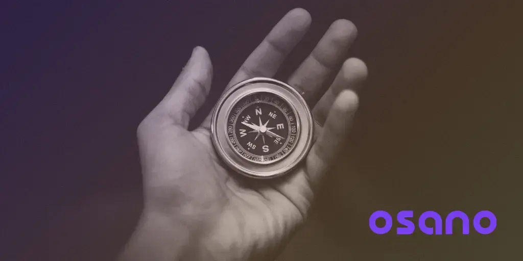 Hand holding compass